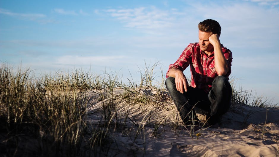 Image depicting a man with a downcast expression, symbolizing depression in men.