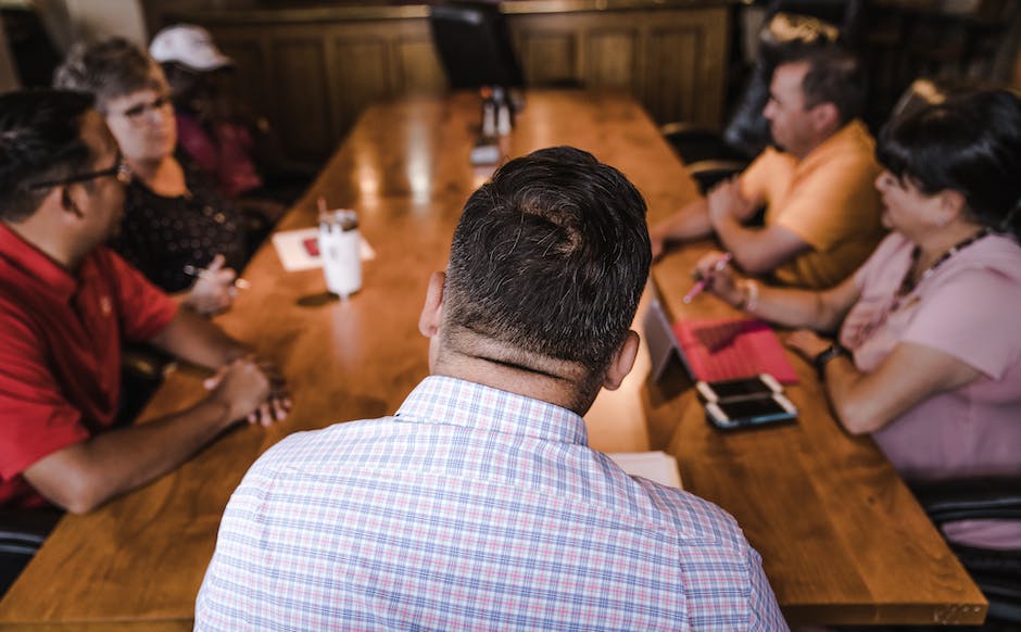 Image of men discussing mental health, creating a supportive environment