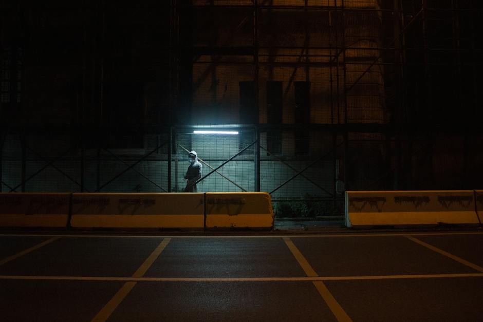 Image depicting a man standing in front of a wall with various barriers symbolizing the challenges men face in seeking mental health support