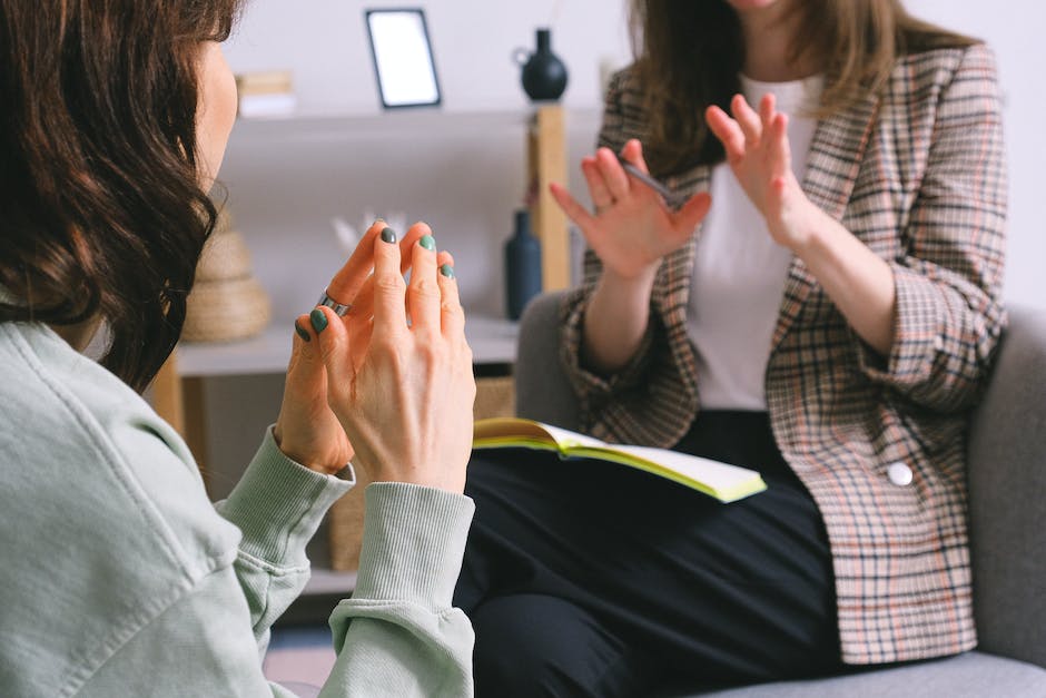 A diverse group of people participating in a mental health support session, displaying compassion and understanding.