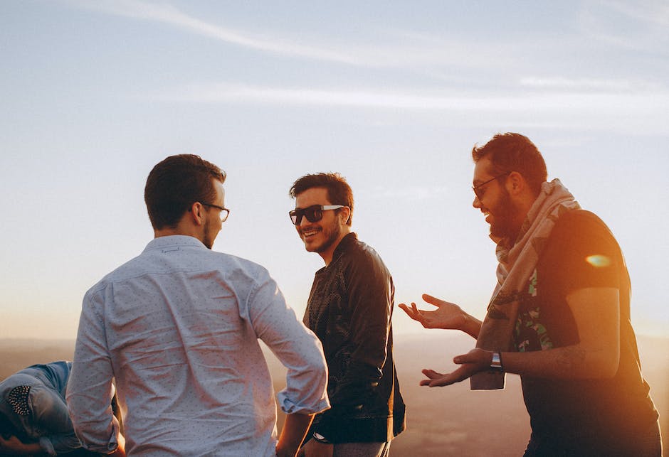 A diverse group of men engaging in discussions and seeking support for their mental health.