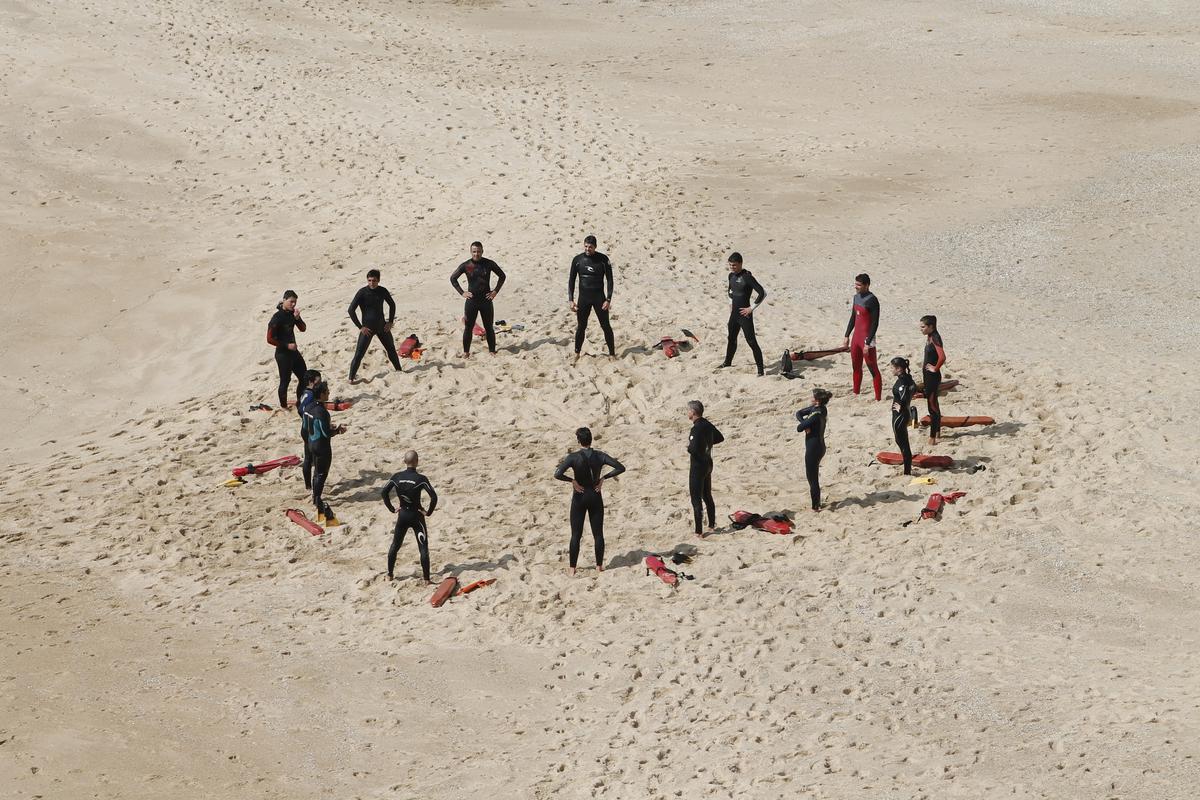 Image description: A diverse group of people sitting in a circle, engaged in a therapy session.